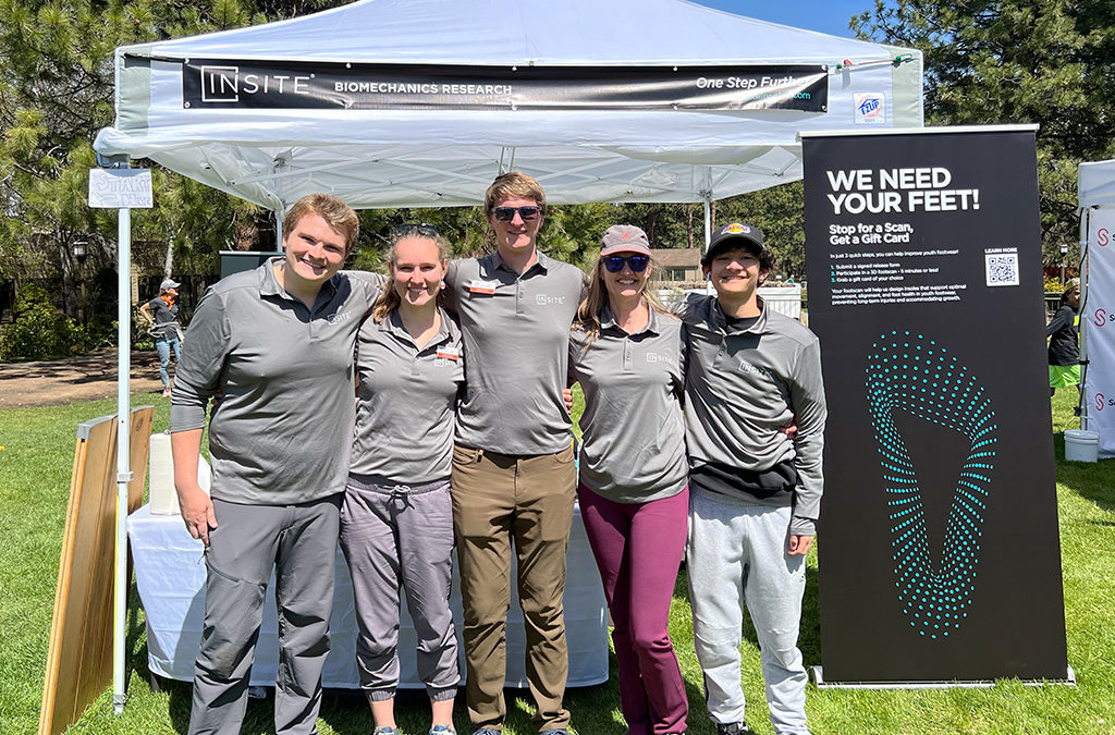 The INSITE biomechanics team and volunteers at the Pole, Pedal, Paddle Booth