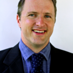 A headshot of Dr. Caleb Dyer