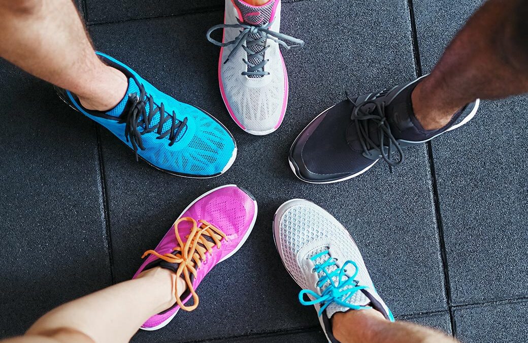 A bunch of different shoes on different people