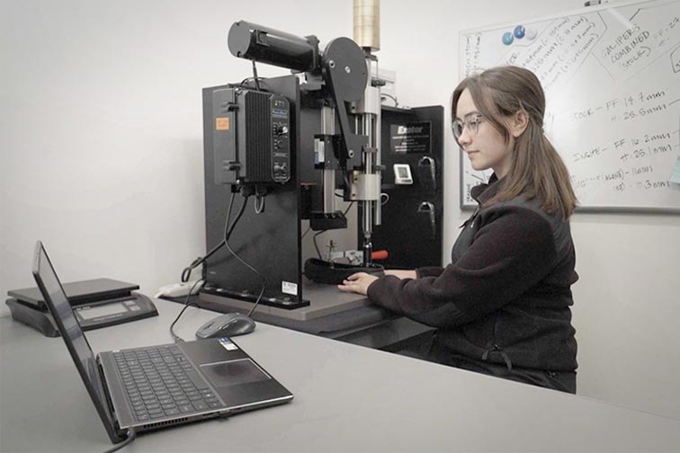 Woman in a lab working with foot scan data